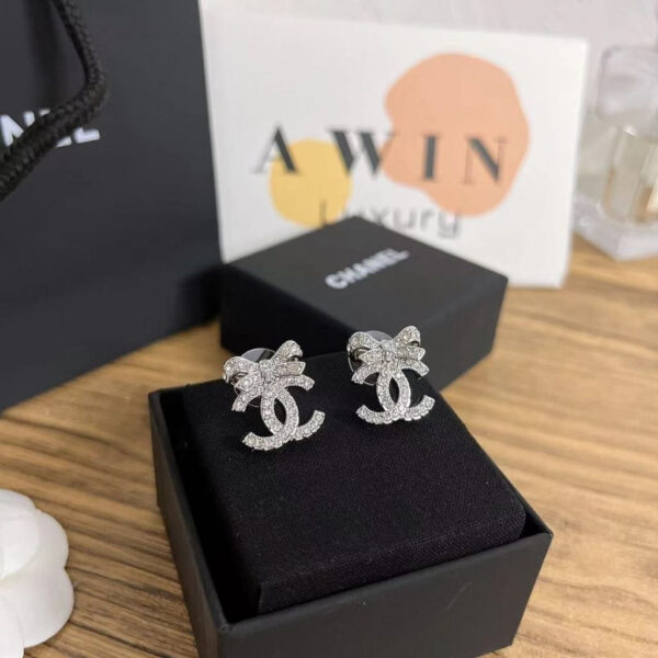 CHANEL Double C metal stud earrings for women